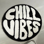 tapis rond noir blanc CHILL VIBES lettres texturées doux moderne salon chambre