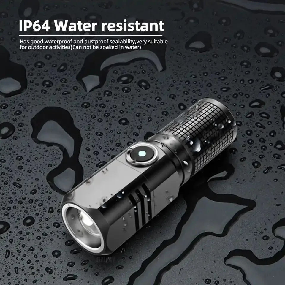 lampe torche noire rechargeable 1600lm ip64 zoom texturée rainures compact moderne