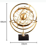 sculpture géométrique moderne sphère dorée anneaux circulaires décoration chambre minimaliste