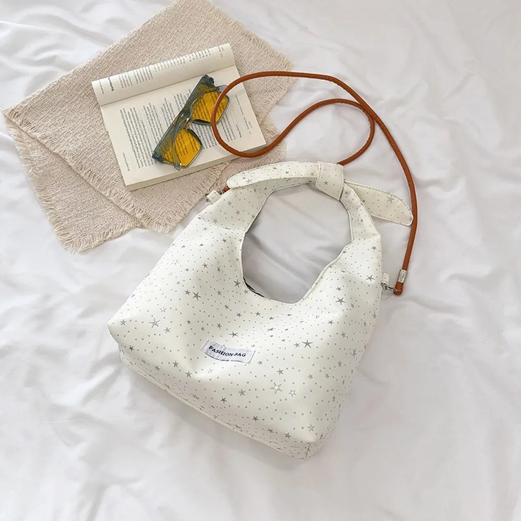 sac main femme rose clair étoiles dorées doux moderne casual tote toile