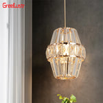 Suspension lumineuse moderne transparente facettes géométriques câble doré élégante chambre salon