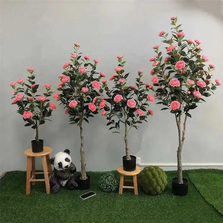 arbre artificiel vert feuilles fleurs roses blancs decoration intérieure moderne pot noir