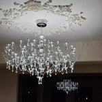 lustre cristal transparent argenté classique branches lumineuses chambre salon