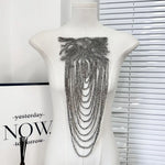 accessoire textile broche franges rouge or noir élégant chic festive decoration