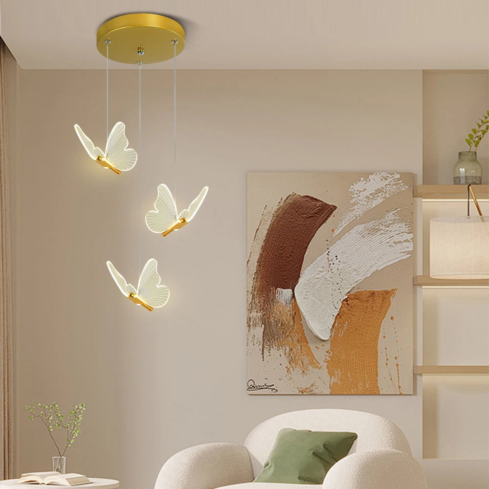 suspension lumineuse moderne or papillons effet lumineux diffus trois têtes