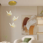 suspension lumineuse moderne or papillons effet lumineux diffus trois têtes