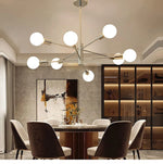 lustre moderne 10 ampoules doré noir chrome sphères blanches structure métallique scandinave