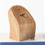 horloge décorative moderne minimaliste aspect bois grainé forme conique ronde aiguilles dorées salon chambre