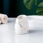 ensemble salle bain moderne marbre doré blanc distributeur savon porte brosse dents tasses plateaux