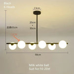 suspension lumineuse moderne têtes boules verre blanc mat noir doré