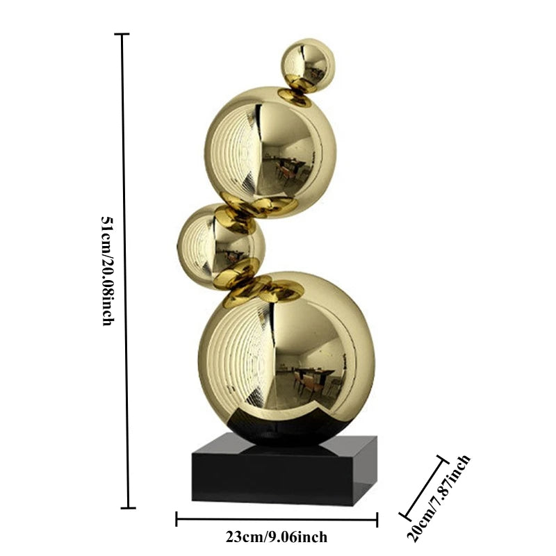 Sculpture décorative moderne or argent sphères polies métal base noire minimaliste