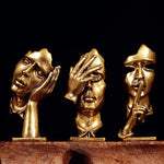 statuette abstraite dorée sculpture visage stylisé moderne décoration salon maison