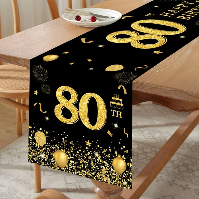 Drapeau de table noir et or pour 80e anniversaire sur une table décorée