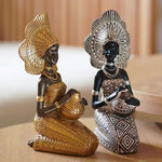 Sculpture africaine femme dorée sur table basse