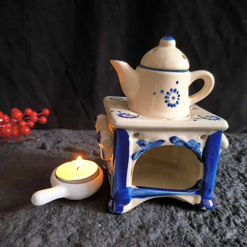 diffuseur huiles essentielles céramique blanc bleu fleurs stylisées rustique théière chauffe thé salon decoration