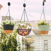 panier suspendu métal ajouré motif floral fibre cocointérieur décoration fleurs plantes verte rustique