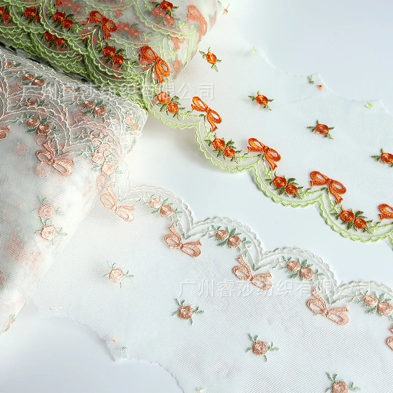 tissu polyester dentelle broderie fleurs rubans bordure élégant blanc orange vertclair 11cm 3mètres translucent