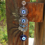 Pendentif oeil turc bleu argenté motifs géométriques artisanal protection maison