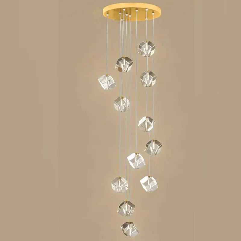 suspension lumineuse moderne transparente dorée facettes géométriques élégantes multiples lampes