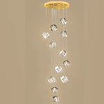 suspension lumineuse moderne transparente dorée facettes géométriques élégantes multiples lampes