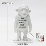 statuette moderne singe résine blanc noir peau texte do nothing vous vivrez plus longtemps