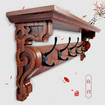 porte manteau étagère murale bois marron foncé crochets décor sculpté motifs floraux classique vis