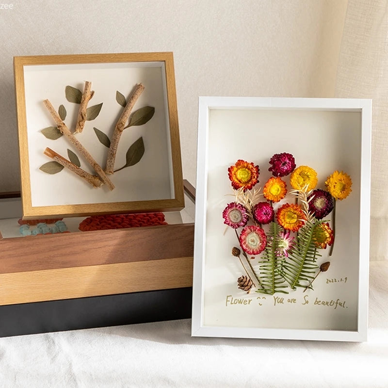 cadres photo fleurs séchées bois clair opaque transparent décoration intérieure nature morte minimaliste bohème