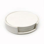 Ensemble de six dessous de verre circulaires blanc ivoire en fibres naturelles.