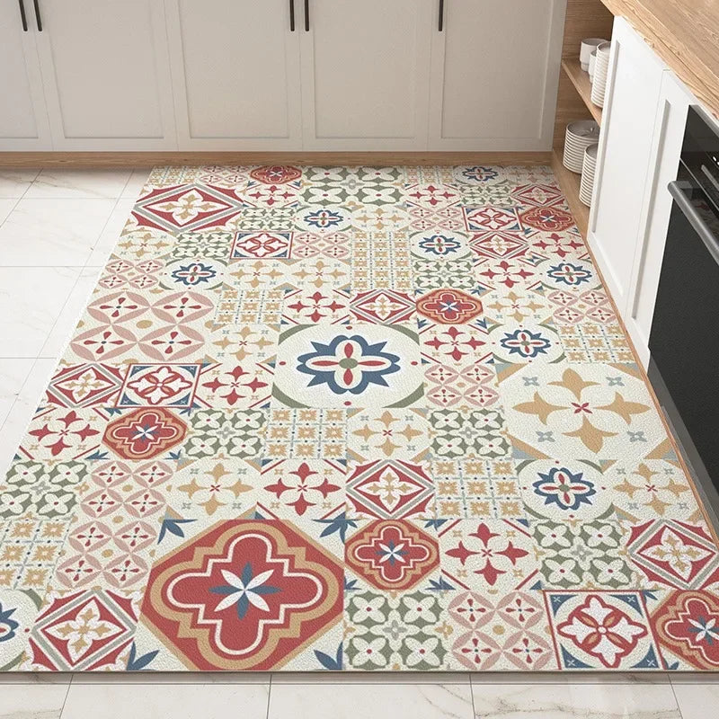 Un tapis carrelé multicolore au motif floral et géométrique, créant une ambiance chaleureuse et authentique dans cette cuisine moderne.