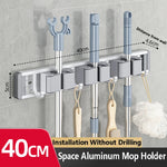 porte balai mural moderne adhésif gris blanc noir Brosse balai gant serviette spray