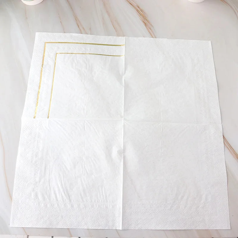 serviettes papier blanc doré classiques occasions festives mariage anniversaire élégantes lignes dorées simples texture