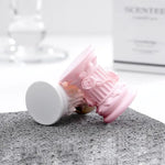 décoration maison colonnes architecturales rose blanche bougie ours peluche citrouille