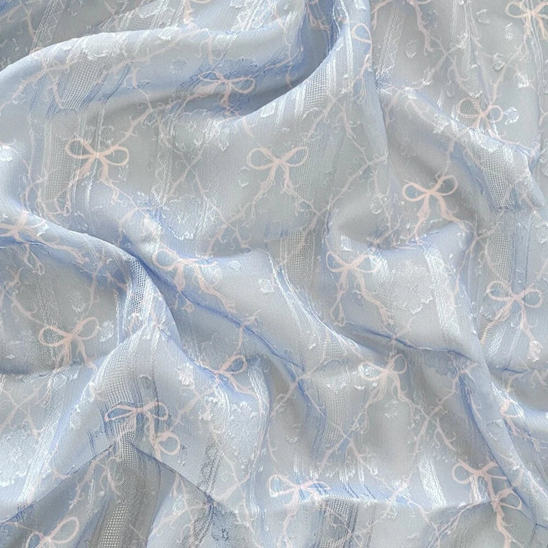 tissu polyester coton rose clair beige bleu clair motif nœuds fleurs élégant romantique 150cm