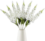 décoration intérieure bouquet artificiel moderne élégant vase livres bougies anniversaire mariage baby shower