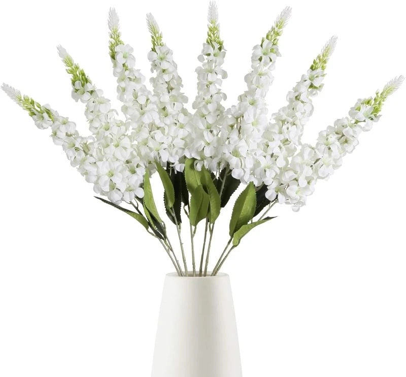 décoration intérieure bouquet artificiel moderne élégant vase livres bougies anniversaire mariage baby shower