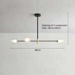 suspension lumineuse moderne minimaliste noir doré blanc sphères translucides métal poli