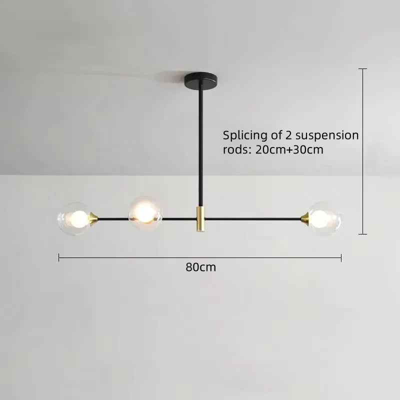 suspension lumineuse moderne minimaliste noir doré blanc sphères translucides métal poli