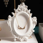 porte bijoux silicone ornements floraux classique baroque colliers or pierres noires blanc