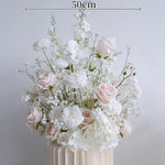 décoration mariage arrangement floral blanc roses orchidées intérieur élégant romantique champêtre