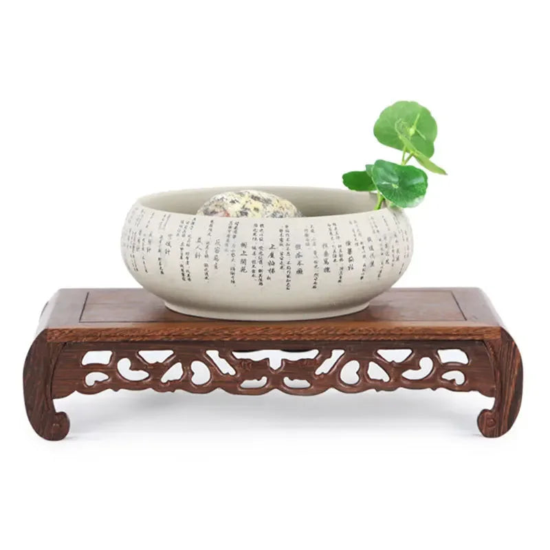 support décoratif bois artisanal marron foncé motifs sculptés table petite vase fleurs théière étagère