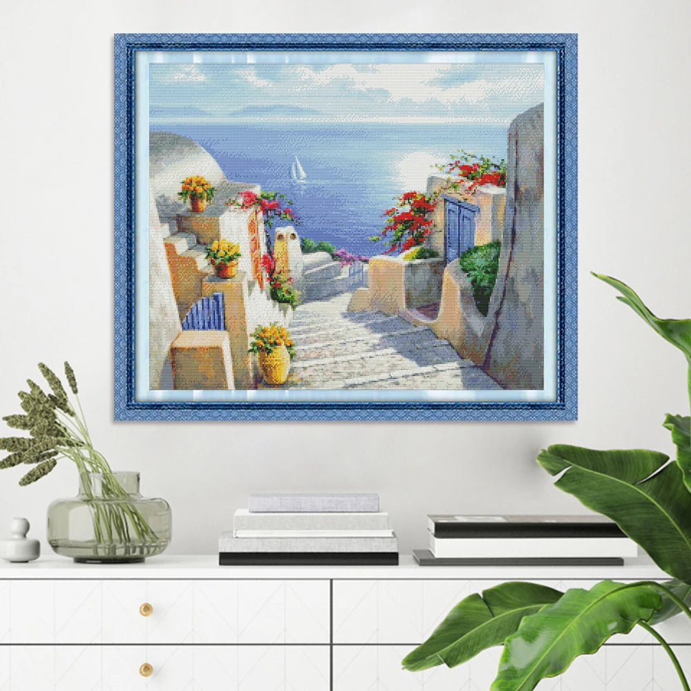 broderie paysage marin maisons blanches escaliers fleurs vases montagnes ciel bleu coton 40x50cm