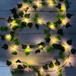 guirlande lumineuse artificielle feuilles vertes lumières led blanc decoration intérieure extérieure noël moderne
