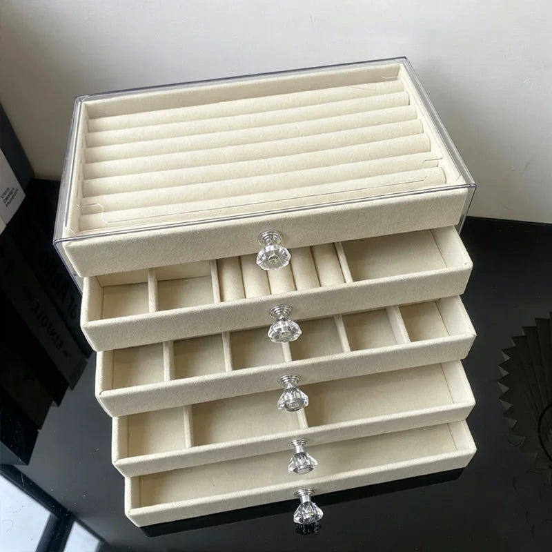 boîte bijoux moderne beige velours transparent tiroirs rangement chic poignées boucles d'oreilles montres