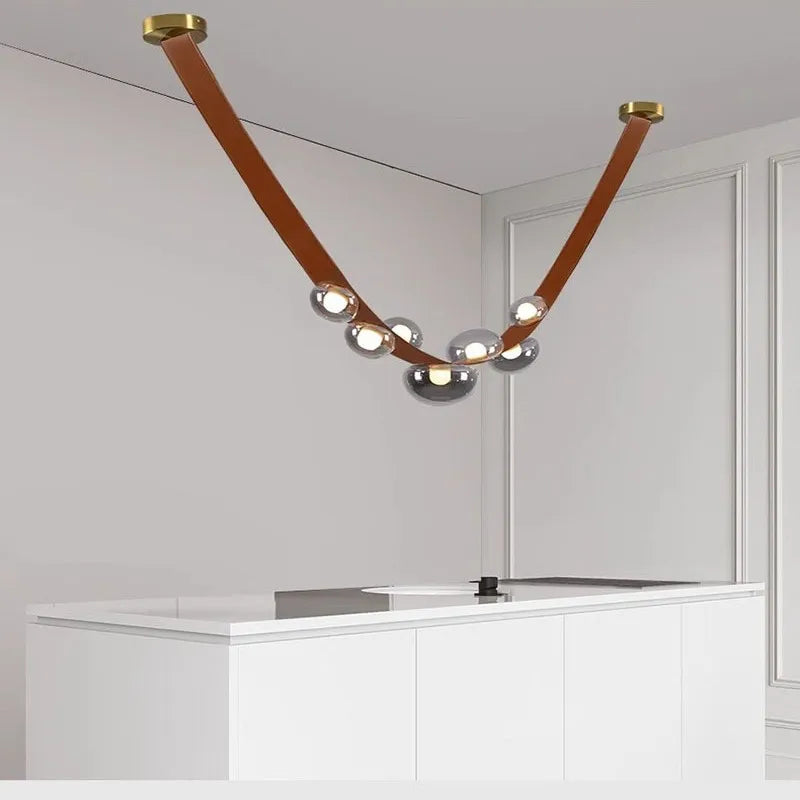 Suspension lumineuse contemporaine boules translucides structure métallique noir marron doré minimaliste