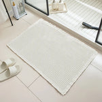 tapis bain moderne gris clair maille géométrique adhésif 43x61cm absorbant antidérapant franges salon