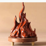 sculpture moderne flamme rouge brillante effet métallique pied bois doré