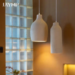 suspension lumineuse moderne beige clair texturée câble suspendu minimaliste lumière led