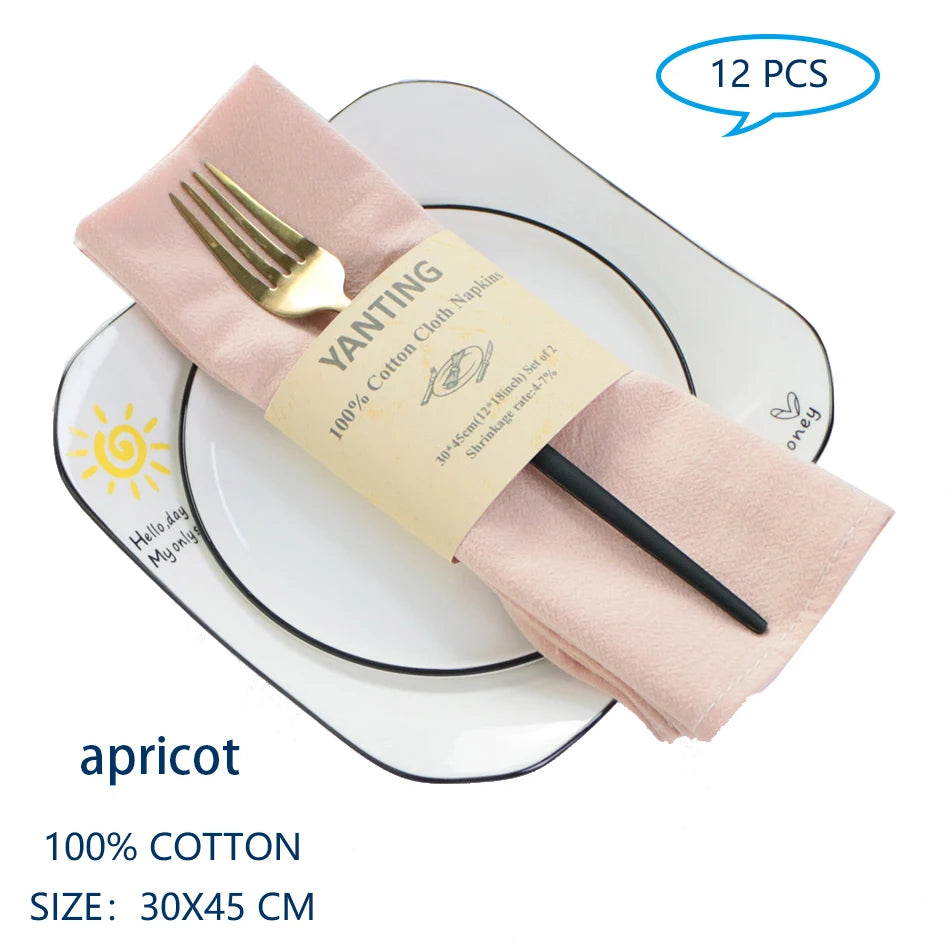 Serviettes de table en coton de couleur abricot, de taille 30 x 45 cm, emballées par 12 pièces.
