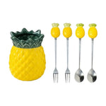 ensemble d'ustensils decoratifs vase ananas fourchettes cuilleres tropical jaune vert foncé losanges ananas