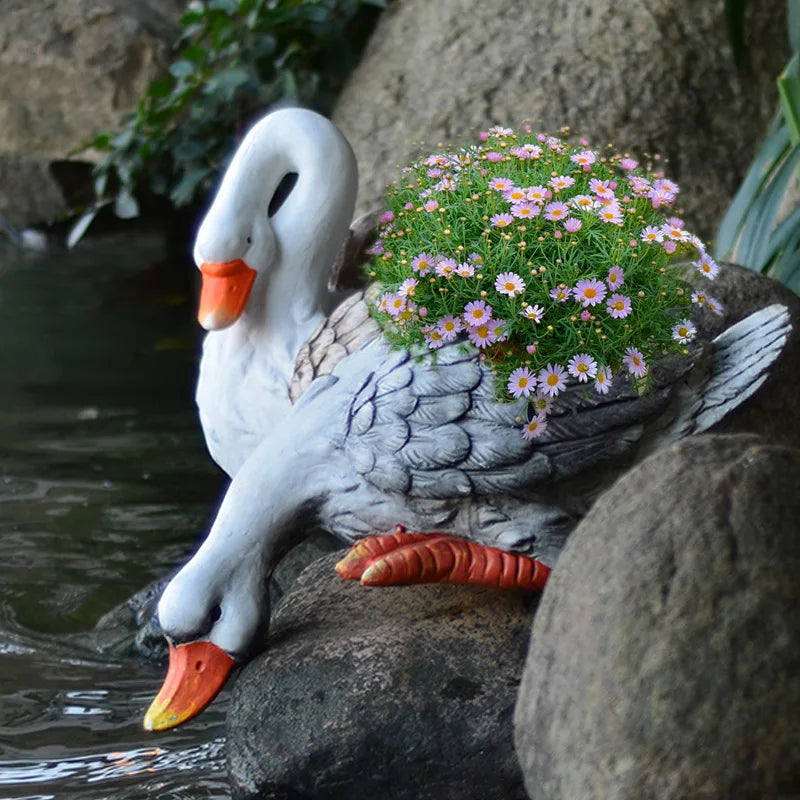 statue cygne pot fleur jardin blanc plumes décoratif fleurs diverses couleurs rock texture rustic